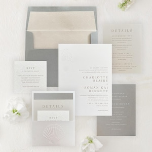 May include: Elegant wedding invitation suite featuring a white embossed design with a seashell motif. The suite includes invitation cards, RSVP cards, and details cards in shades of white and gray. The text includes the names Charlotte Blaire and Roman Kai Bennett.