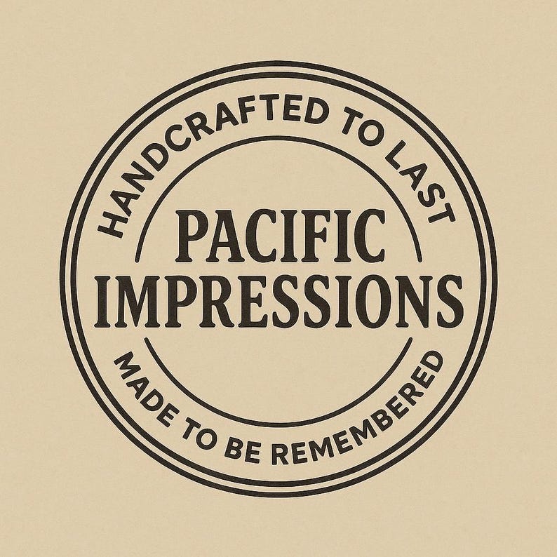 A black and white circular logo with the text "HANDCRAFTED TO LAST" and "PACIFIC IMPRESSIONS" inside it.