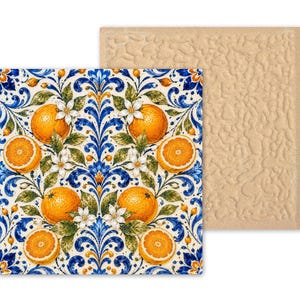 May include: A square coaster featuring a vibrant pattern of bright orange citrus fruits, green leaves, and white blossoms set against a deep blue and white scrollwork background. The reverse side of the coaster has a textured, light beige surface.