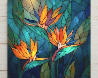 May include: A square stained glass panel featuring three bird of paradise flowers with vibrant orange and yellow petals. The background consists of overlapping leaves in various shades of teal, blue, and green, all connected by dark lead lines.