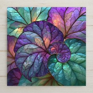 May include: A square wall art piece featuring a vibrant, iridescent botanical pattern of overlapping leaves arranged in a spiral formation. The leaves display a rich gradient of deep purple, teal, and blue tones with visible vein structures.