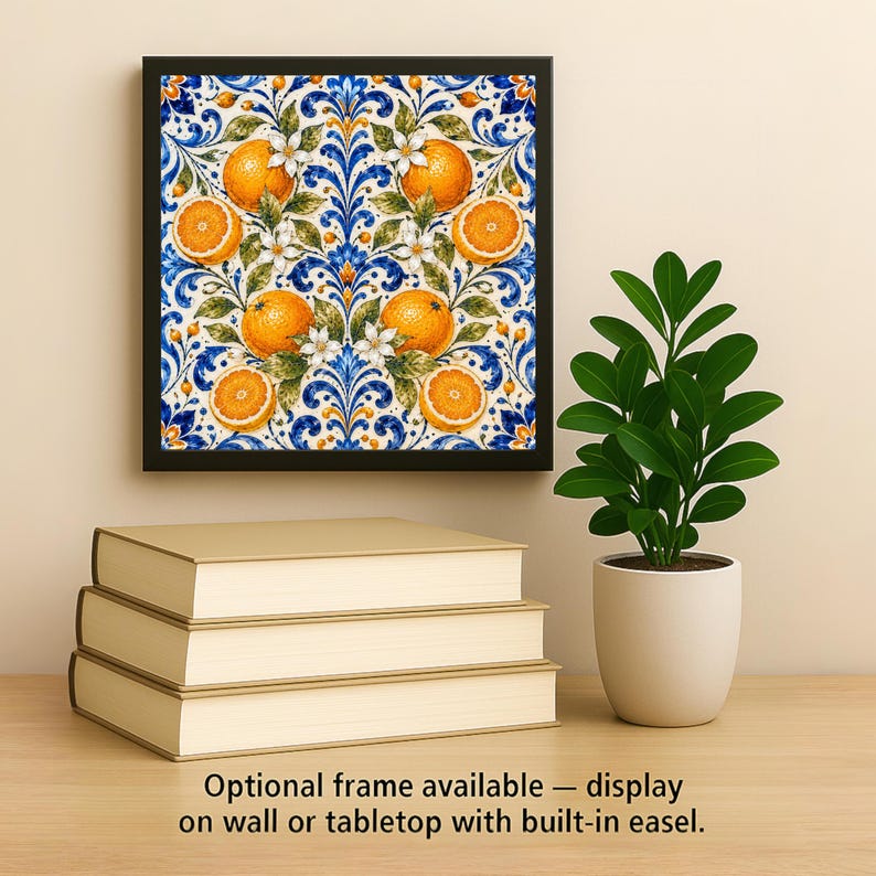 May include: A square wall art piece featuring a vibrant pattern of oranges, green leaves, and white blossoms set against a blue and white scrollwork background, enclosed in a black frame. The text reads: Optional frame available.