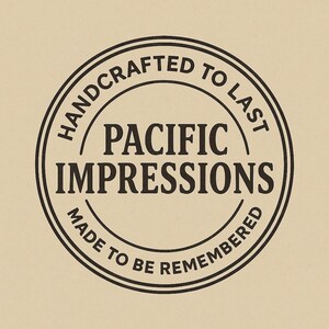 A black and white circular logo with the text "HANDCRAFTED TO LAST" and "PACIFIC IMPRESSIONS" inside it.