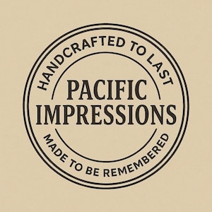 A black and white circular logo with the text "HANDCRAFTED TO LAST" and "PACIFIC IMPRESSIONS" inside it.