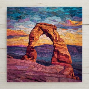 May include: A square wall art print featuring a stained glass style mosaic of a natural rock arch formation. The scene displays a vibrant sunset with shades of orange, yellow, purple, and blue, composed of interlocking geometric glass-like segments.