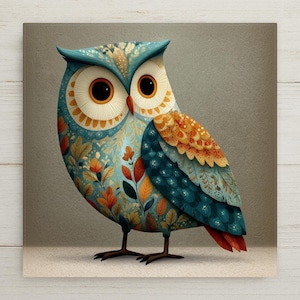 May include: A square wall art print featuring a stylized owl with large dark eyes and a sharp orange beak. The owl's plumage is decorated with a detailed pattern of blue, orange, and yellow leaves and floral motifs against a neutral background.