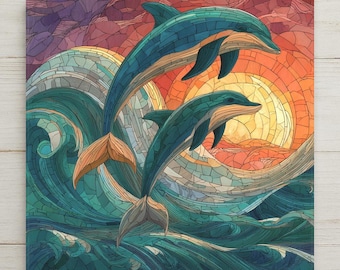 May include: A square wall art piece featuring a mosaic-style illustration of two teal dolphins leaping through ocean waves. The background displays a vibrant sunset with shades of orange, yellow, and purple, all rendered in a segmented, stained-glass pattern.