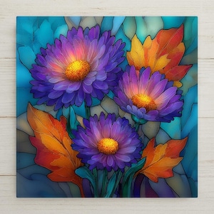 May include: A square wall art piece featuring a stained glass style illustration of three purple flowers with bright yellow centers, surrounded by orange leaves and a blue background with dark outlines defining each segment of the composition.