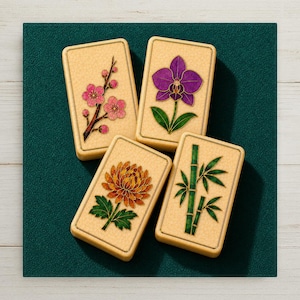 May include: Four rectangular mahjong tiles with a cream-colored textured surface. Each tile features a distinct inlaid design: a pink plum blossom branch, a purple orchid, an orange chrysanthemum, and green bamboo stalks with leaves.