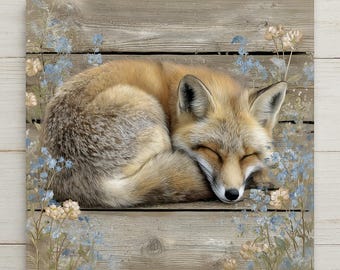 May include: A square wall art print featuring a sleeping red fox curled up on a weathered gray wooden plank background, surrounded by delicate light blue and pale beige wildflowers that frame the central animal figure in a soft composition.