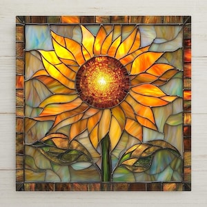 This glowing sunflower ceramic tile features a radiant mosaic center, warm amber petals, and green leaves in a stained glass style. Perfect for rustic wall decor or gifting. Optional hanger, cork backing, and tile stand available.