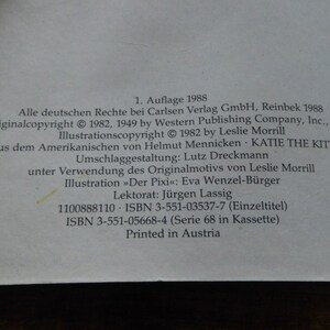 Puede incluir: Una portada de libro con el t&iacute;tulo "KATIE THE KITTEN" en letras negras y en negrita. El libro es de la serie "Der Pixi" y est&aacute; impreso en Austria. La informaci&oacute;n de copyright aparece en la contraportada.