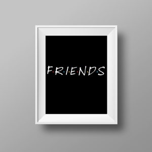 May include: White framed print with a black background and the word "FRIENDS" in white with colorful dots between the letters.