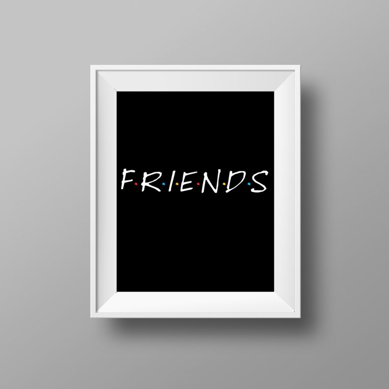 May include: White framed print with a black background and the word "FRIENDS" in white with colorful dots between the letters.