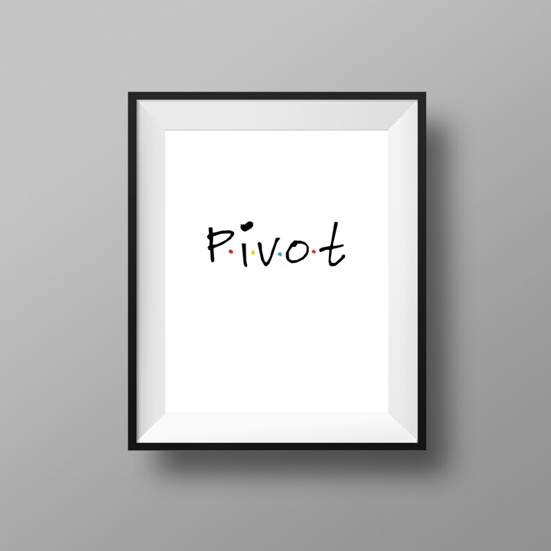 May include: A black framed print with the word "PIVOT" written in black marker with colorful dots.