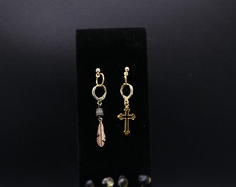 Bonus Pair!! The first pair features one gold cross and a gold feather. The bonus pair features a sun and a moon.