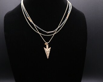 Gold, triple layered necklace with arrow pendant