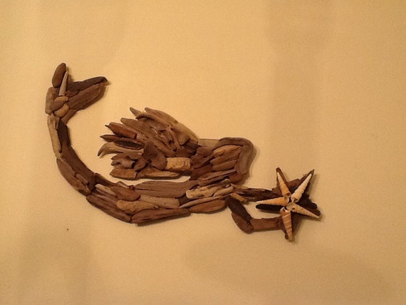 Swimming Mermaid holding Star