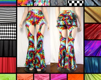 May include: Tie-dye bell-bottom pants featuring cut-out thigh sections and a ruffled back skirt detail. The garment displays a vibrant, multi-colored spiral pattern throughout, with flared leg openings and a fitted waistline design.