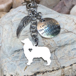 May include: Silver keychain with a dog silhouette, angel wings, and a round charm with the text "I will hold you in my heart until I hold you in heaven".