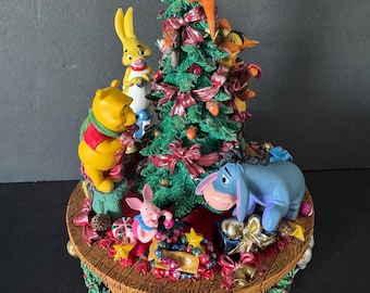 Disney’s Winnie the Pooh and friends decorate the Christmas tree music box