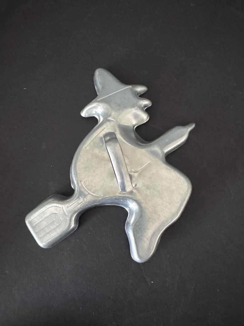 Vintage aluminum metal cookie cutters—sold separately witch, bent handle
