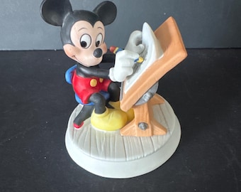 Ceramic Mickey Mouse working at a desk, drawing cartoon by Disney