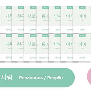 May include: A green and white illustrated flashcard set with Korean, French, and English words for people. The Korean word "사람" (saram) is shown, meaning "person" in English. The card also shows the French word "personnes" and the English word "people".