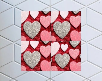 May include: A red velvet background with silver and pink glitter hearts. The hearts are arranged in a repeating pattern.