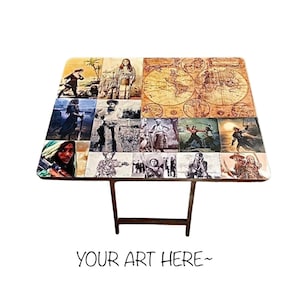 May include: A wooden folding table with a collage of vintage images on the top. The images include people, maps, and landscapes. The table is brown and has a simple design.