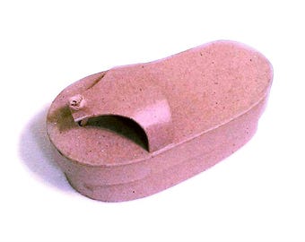 May include: A light brown, textured, sandal-shaped, paper mache box.