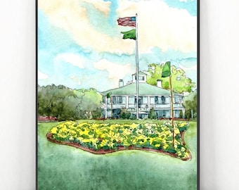May include: Watercolor painting of a white building with a green roof, an American flag, and a green flag. The building is surrounded by green grass and yellow flowers. The artwork is framed in a black frame.