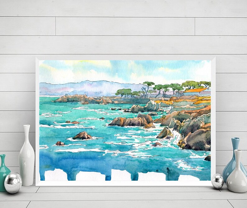 May include: Watercolor painting of a seascape with rocky cliffs and turquoise water. The painting features a line of trees in the background and a bright blue sky.