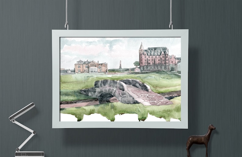 May include: A watercolor painting of a golf course with a stone bridge, a large building, and a smaller building in the background.