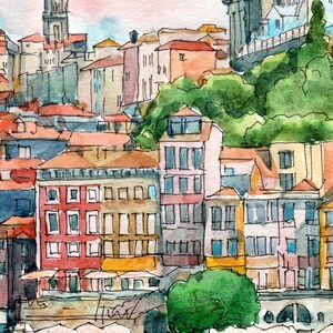 K&ouml;nnte beinhalten: Aquarellmalerei einer Stadtlandschaft mit bunten Geb&auml;uden, einer Kirche mit einer Kuppel und einem Fluss mit Booten. Der Himmel ist hellblau mit rosa Wolken.