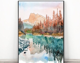 May include: Watercolor painting of a mountain landscape with a lake. The artwork features a mountain range in shades of brown and green, with a lake reflecting the trees and sky. The painting is framed in a black frame.