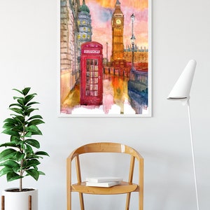 May include: A watercolor painting of Big Ben and the Houses of Parliament in London, England. A red telephone booth is in the foreground. The sky is a vibrant orange and pink.