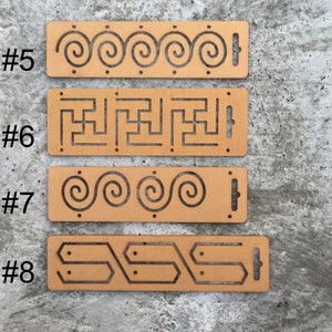 May include: Four wooden stencils with different patterns, numbered 5 through 8. The stencils are brown and have a rectangular shape. Each stencil has a different design, including spirals, a maze, and geometric shapes.