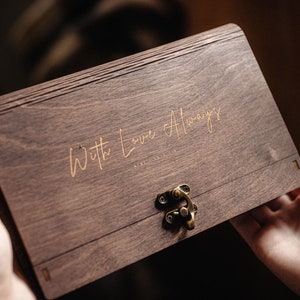 May include: A wooden box with a brass latch. The box is engraved with the words "With Love Always".