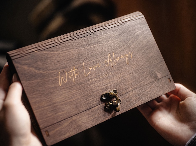 May include: A wooden box with a brass latch. The box is engraved with the words "With Love Always".