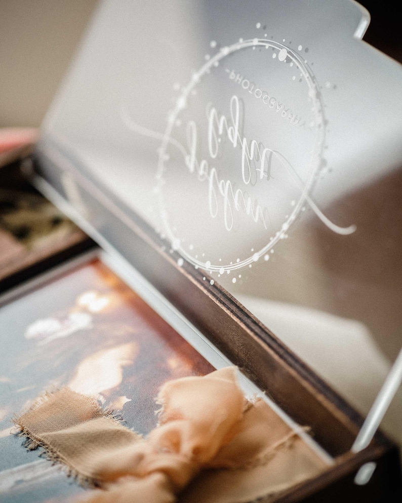 Close-up inside view of acrylic lid engraving over a 4x6 print in the wooden photo box.