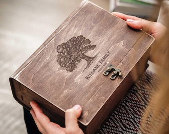 May include: A wooden photo box with a hinged lid and a brass latch. The box is engraved with a tree design and the text "Kissane Family Photo Box".