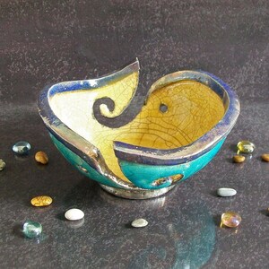 raku ceramic yarn bowl with swirled holes, customizable colors, gift for knitters, knitting bowl, yarn holder, yarn lovers gift
