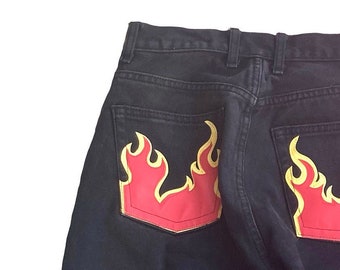 jeans with flames at the bottom