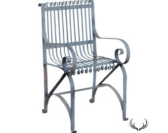 May include: A vintage metal garden chair with a gray painted finish. The chair has a scrolled back and arms, and a slatted seat.