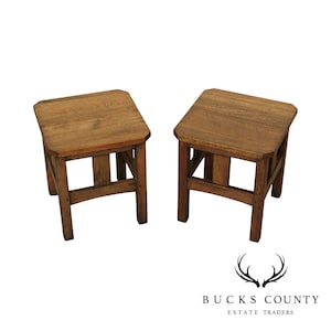 May include: Two wooden end tables with a simple, square design. The tables have a dark brown stain and a geometric, open frame.