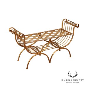 May include: A gold-toned metal bench featuring a lattice-patterned seat and a lower shelf. The frame has curved, scroll-like armrests on both ends and arched legs. The structure is composed of thin metal rods with a metallic finish throughout.