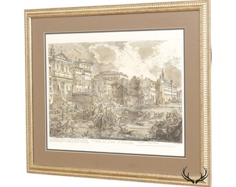 May include: A framed black and white print of an old engraving depicting a cityscape with a canal and many boats. The print is titled "Veduta del Porto di Ripetta".