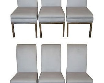 May include: Six light gray dining chairs with a silver metal frame. The chairs have a simple, modern design.