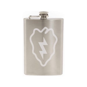 May include: A silver stainless steel flask with a white lightning bolt design. The design is a stylized representation of the 101st Airborne Division patch.